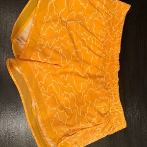 Athleta Mesh Rader Run Mid Rise 4” Short (yellow and white)